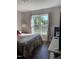 Sunlit bedroom with a cozy bed and decorative curtains, perfect for a peaceful night's sleep at 956 W Greensboro Chapel Hill Rd, Snow Camp, NC 27349