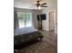 Relaxing bedroom offering natural light, complemented by stylish furnishings and scenic outdoor views at 956 W Greensboro Chapel Hill Rd, Snow Camp, NC 27349