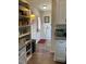 Charming kitchen featuring custom cabinets and granite countertops that complement a rustic entrance hall at 956 W Greensboro Chapel Hill Rd, Snow Camp, NC 27349
