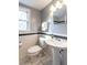 Stylish bathroom with a pedestal sink, toilet, and white and grey color scheme at 979 St Marys St # G6, Raleigh, NC 27605