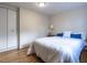 Bright bedroom featuring a comfortable bed, hardwood floors, and a closet at 979 St Marys St # G6, Raleigh, NC 27605