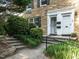 Close up of the front door entrances of this two-story stone home with black shutters at 979 St Marys St # G6, Raleigh, NC 27605