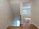 Bright hallway with hardwood floors leads to naturally lit rooms, creating a warm and inviting space at 979 St Marys St # G6, Raleigh, NC 27605