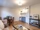 Cozy living area with hardwood floors, a compact kitchen, and comfortable seating for a welcoming atmosphere at 979 St Marys St # G6, Raleigh, NC 27605