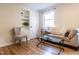 Comfortable living room with hardwood floors, neutral décor, and built-in shelving for added storage and style at 979 St Marys St # G6, Raleigh, NC 27605