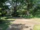 Pathway with lush green trees leads to red brick building at 979 St Marys St # G6, Raleigh, NC 27605