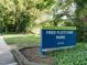 Sign for Fred Fletcher Park in Raleigh with lush green surroundings at 979 St Marys St # G6, Raleigh, NC 27605