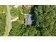 Lush trees surround the property, as seen in this full aerial photograph at 1008 Old Meetinghouse Way, Raleigh, NC 27615