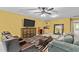 Finished basement offering a media space with a large TV, seating, and wet bar at 1008 Old Meetinghouse Way, Raleigh, NC 27615