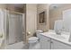 Modern bathroom featuring a walk-in shower, white vanity, white floors, and toilet at 1008 Old Meetinghouse Way, Raleigh, NC 27615