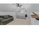 Attic bedroom with vaulted ceilings, unique details, ceiling fan, and bright light at 1008 Old Meetinghouse Way, Raleigh, NC 27615