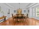 Beautifully staged dining room with wood floors and natural light at 1008 Old Meetinghouse Way, Raleigh, NC 27615