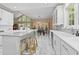 Open-concept kitchen with a large island, modern appliances, and ample natural light at 1008 Old Meetinghouse Way, Raleigh, NC 27615