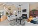 Spacious living room with fireplace, built-in shelving, and staircase at 1008 Old Meetinghouse Way, Raleigh, NC 27615