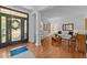Stylish living room featuring hardwood floors and a decorative glass front door at 1008 Old Meetinghouse Way, Raleigh, NC 27615