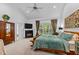 Cozy main bedroom with fireplace, large window, and ensuite access at 1008 Old Meetinghouse Way, Raleigh, NC 27615