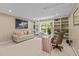 Bright home office featuring custom built-ins, a modern desk, and large window at 1008 Old Meetinghouse Way, Raleigh, NC 27615