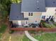 Aerial view of the home's fenced backyard with patio, walkway, and plantings at 1009 Porchside Dr, Apex, NC 27502