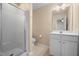 Bathroom featuring a vanity with mirror and a step-in shower at 1009 Porchside Dr, Apex, NC 27502