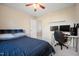 Bedroom featuring natural light, desk area with computer monitors, and stylish decor at 1009 Porchside Dr, Apex, NC 27502
