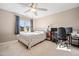 Comfortable bedroom with ceiling fan, desk and chair, and plenty of natural light at 1009 Porchside Dr, Apex, NC 27502