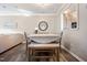 Bright dining area with a table and bench seating, seamlessly connected to the adjacent living room at 1009 Porchside Dr, Apex, NC 27502