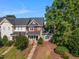 Beautiful townhome with meticulous landscaping and a welcoming front porch at 1009 Porchside Dr, Apex, NC 27502
