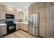 Updated kitchen featuring modern appliances, ample cabinet space, and bright countertops at 1009 Porchside Dr, Apex, NC 27502