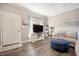 Cozy living room with a sofa, entertainment center, and lots of natural light at 1009 Porchside Dr, Apex, NC 27502