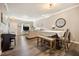 Open-concept living space with a dining area, living room, and a piano, perfect for entertaining at 1009 Porchside Dr, Apex, NC 27502