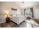Sun-filled main bedroom with vaulted ceiling, picture window, and neutral paint at 1009 Porchside Dr, Apex, NC 27502
