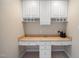 Built-in desk with cabinets and drawers provides a functional workspace at 1009 Porchside Dr, Apex, NC 27502