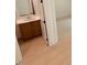 Bathroom featuring a vanity with sink, wood floors, and natural light at 1015 Regalia Rd # 27, Durham, NC 27713