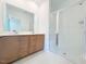 Bathroom featuring a large vanity with double sinks, a glass shower door, and modern fixtures at 1015 Regalia Rd # 27, Durham, NC 27713