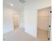 Bright bedroom with walk-in closets, neutral walls, and plush carpeting at 1015 Regalia Rd # 27, Durham, NC 27713