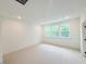 This is a bright bedroom with neutral carpet and large windows offering great natural light at 1015 Regalia Rd # 27, Durham, NC 27713