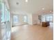 Spacious living room featuring hardwood floors and large windows, creating a bright and inviting atmosphere at 1015 Regalia Rd # 27, Durham, NC 27713