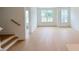 Bright living area showcases wood floors and ample natural light from the large windows at 1015 Regalia Rd # 27, Durham, NC 27713