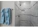 Beautifully tiled shower with built-in niche and modern fixtures create a luxurious bathroom experience at 102 Alidade Ct, Cary, NC 27513