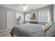 Bright bedroom with ample natural light, complemented by stylish furnishings and a serene atmosphere at 102 Alidade Ct, Cary, NC 27513