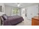 Serene bedroom features a window with natural light and an ensuite bathroom, adjacent to closet at 102 Alidade Ct, Cary, NC 27513