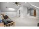 Open bonus room provides a versatile space with modern lighting fixtures and plenty of room for recreation at 102 Alidade Ct, Cary, NC 27513
