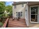 Wooden deck with outdoor seating, ideal for relaxing and entertaining, offering a beautiful view of the surrounding landscape at 102 Alidade Ct, Cary, NC 27513
