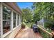 Spacious wooden deck with a grill and view of the gazebo and backyard at 102 Alidade Ct, Cary, NC 27513