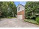Charming two-story home features brick accents, a well-manicured yard, and a rear entry garage at 102 Alidade Ct, Cary, NC 27513