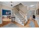 Traditional foyer featuring hardwood floors, staircase, and views into the dining and living rooms at 102 Alidade Ct, Cary, NC 27513