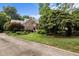 Beautiful brick home with mature trees and landscaping at 102 Alidade Ct, Cary, NC 27513