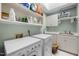 Well-equipped laundry room with modern washer, dryer, and ample storage and countertop space at 102 Alidade Ct, Cary, NC 27513