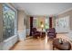 Formal living room with hardwood floors, decorative window and trim at 102 Alidade Ct, Cary, NC 27513