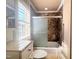 Bathroom with shower featuring neutral paint, stone counters, and glass door at 112 Salmon River Dr, Durham, NC 27705